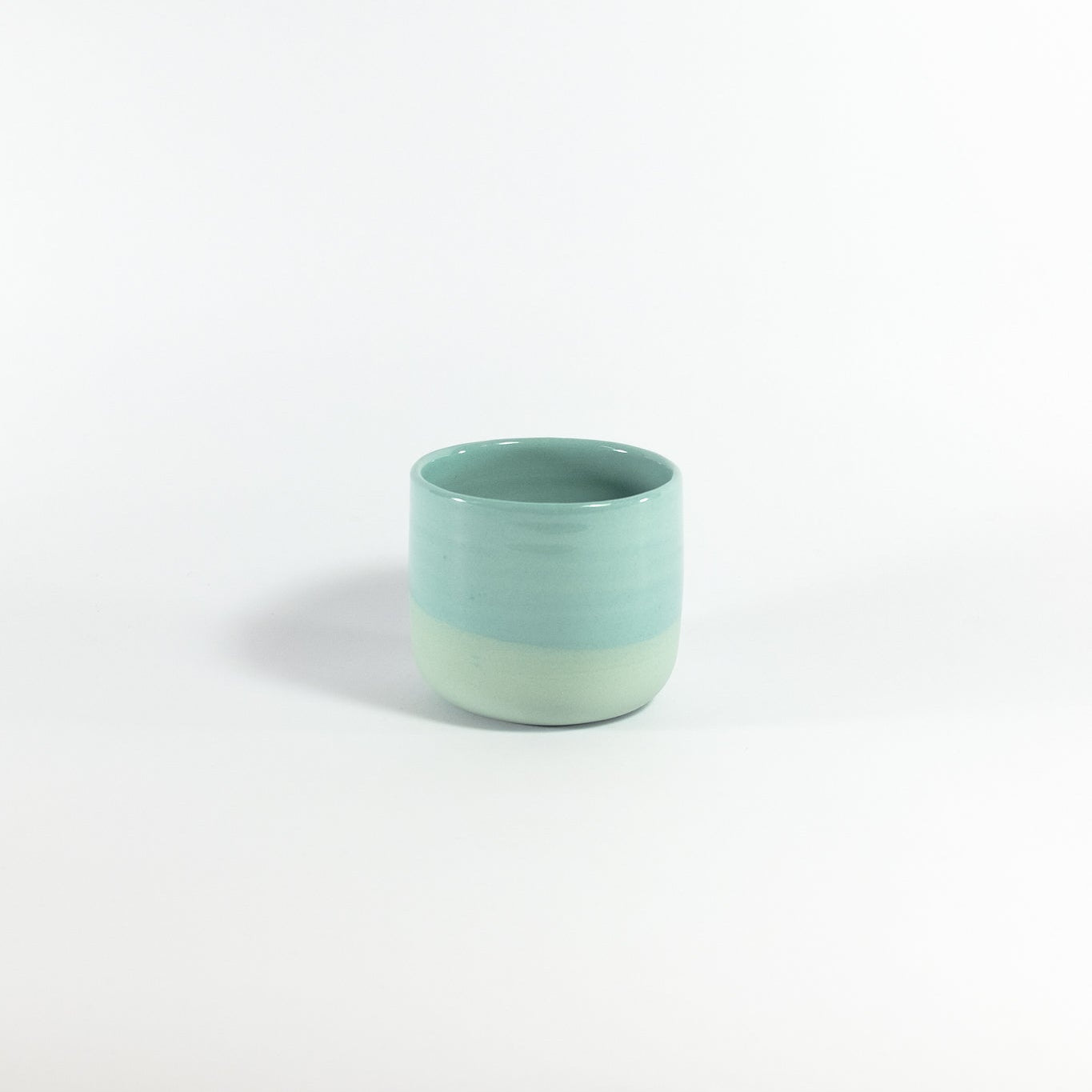 Blue ceramic cup on a white background