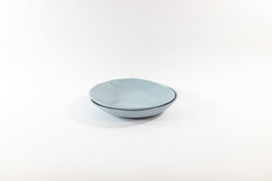 Handmade two lavender pasta plates on a white background
