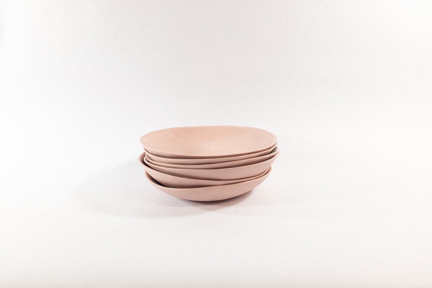 Handmade powder pasta plates on a white background
